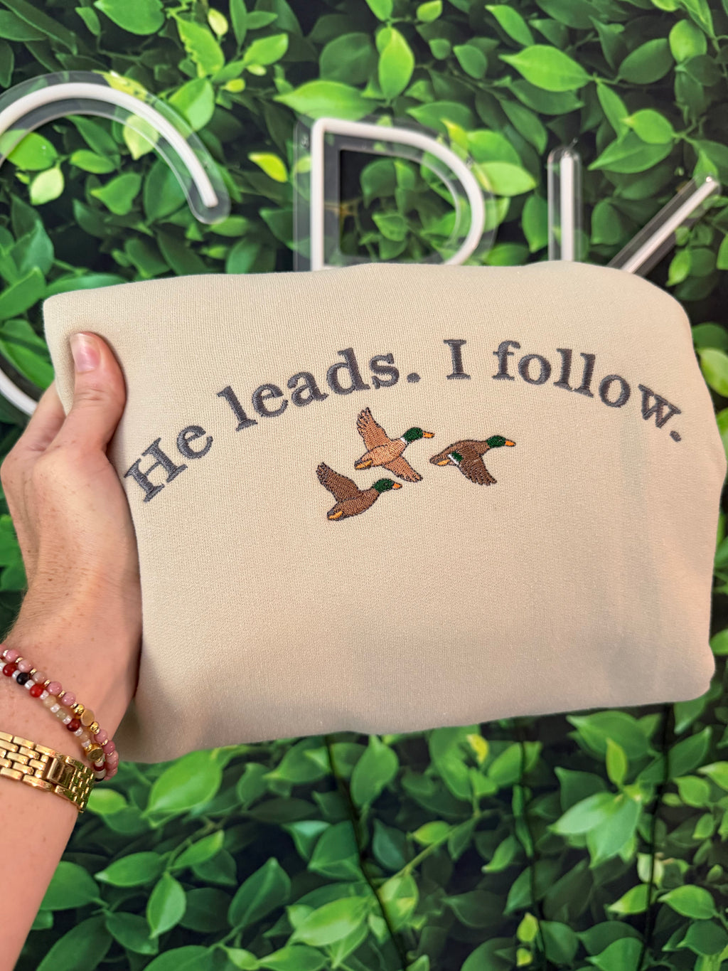He leads. crewneck
